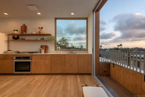 a view of a kitchen with a sink and dishwasher