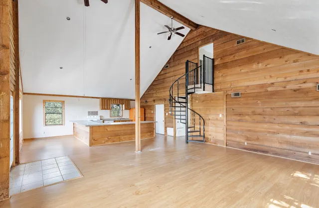 a view of a living room with a large window