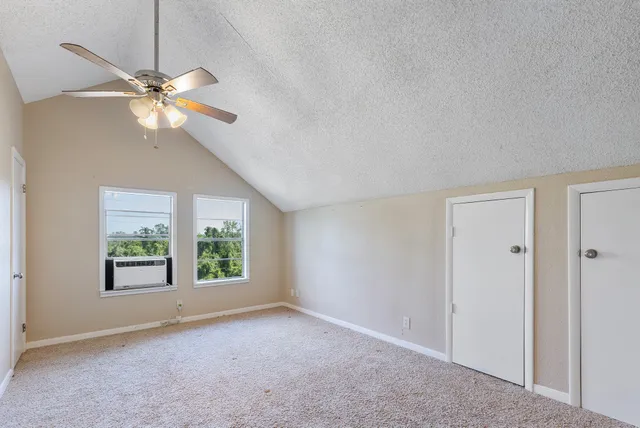 a bathroom with a double vanity sink mirror and shower