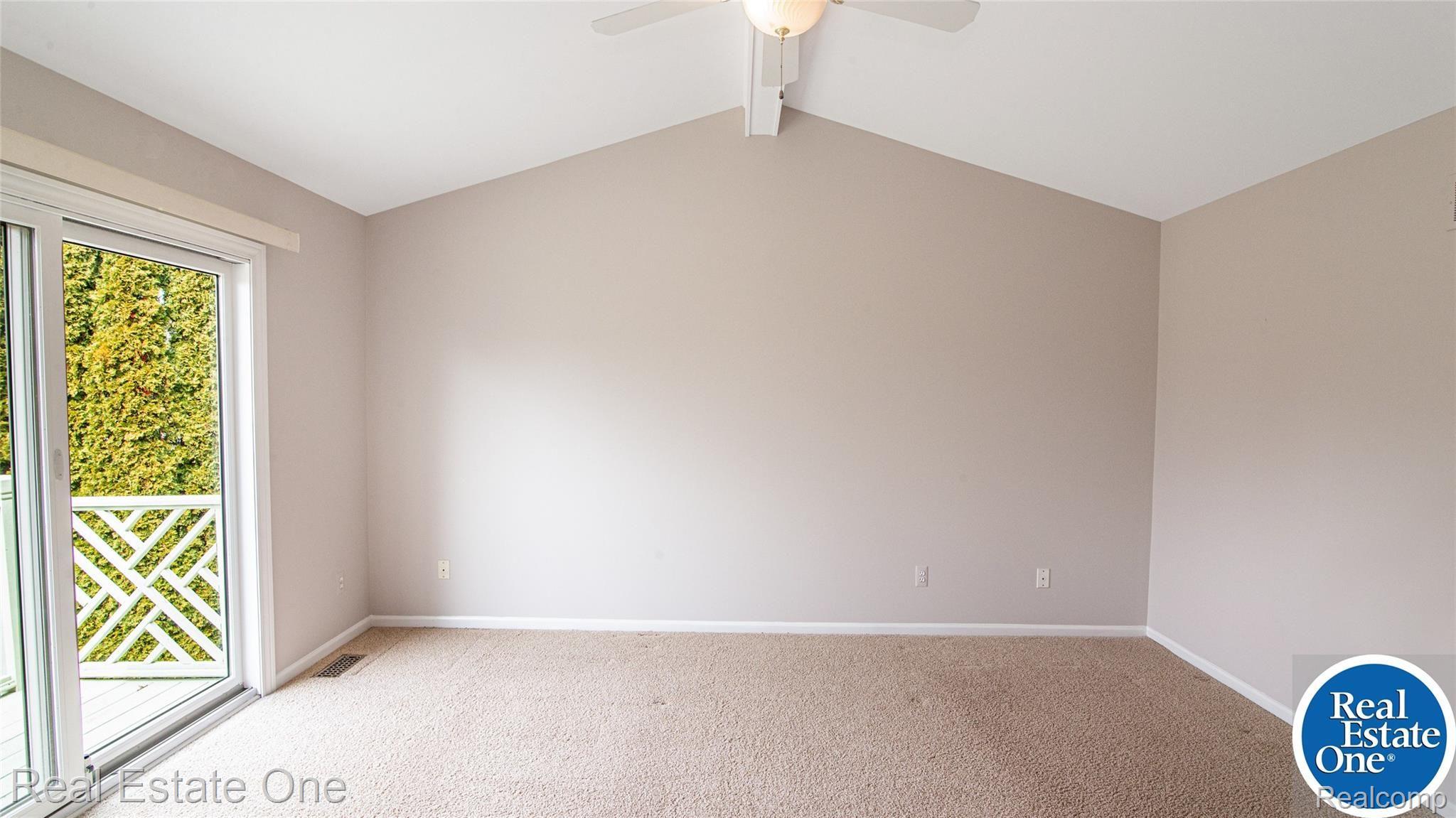 19449 Newburgh Road Livonia, MI 48152 - Photo 21 of 41 Primary bedroom with vaulted ceiling.