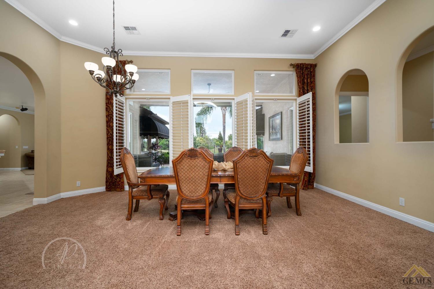 Undisclosed Address Bakersfield, CA 93311 - Photo 11 of 33 a view of a dining room with furniture and a chandelier
