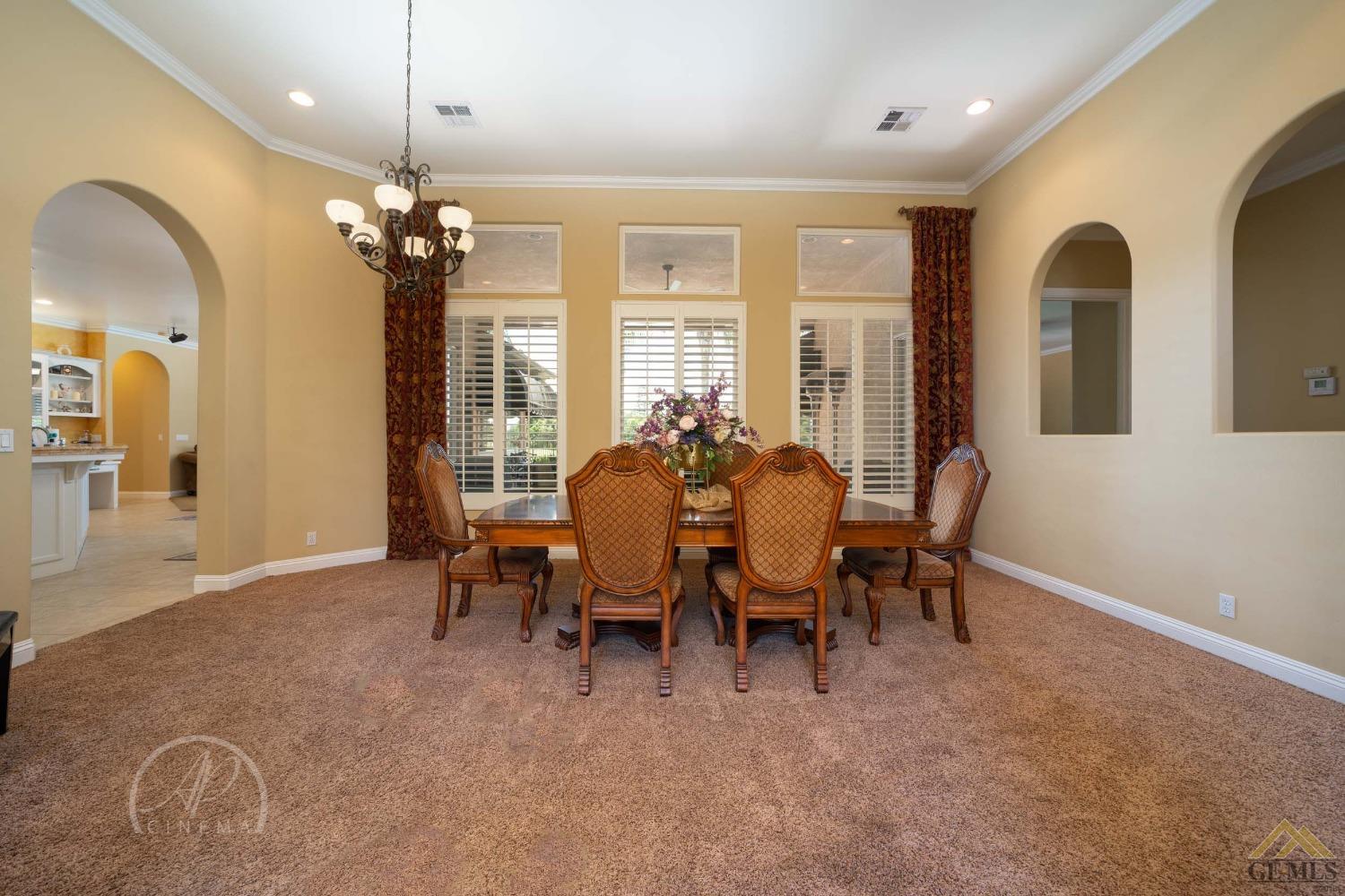 Undisclosed Address Bakersfield, CA 93311 - Photo 12 of 33 a view of a dining room with furniture and chandelier