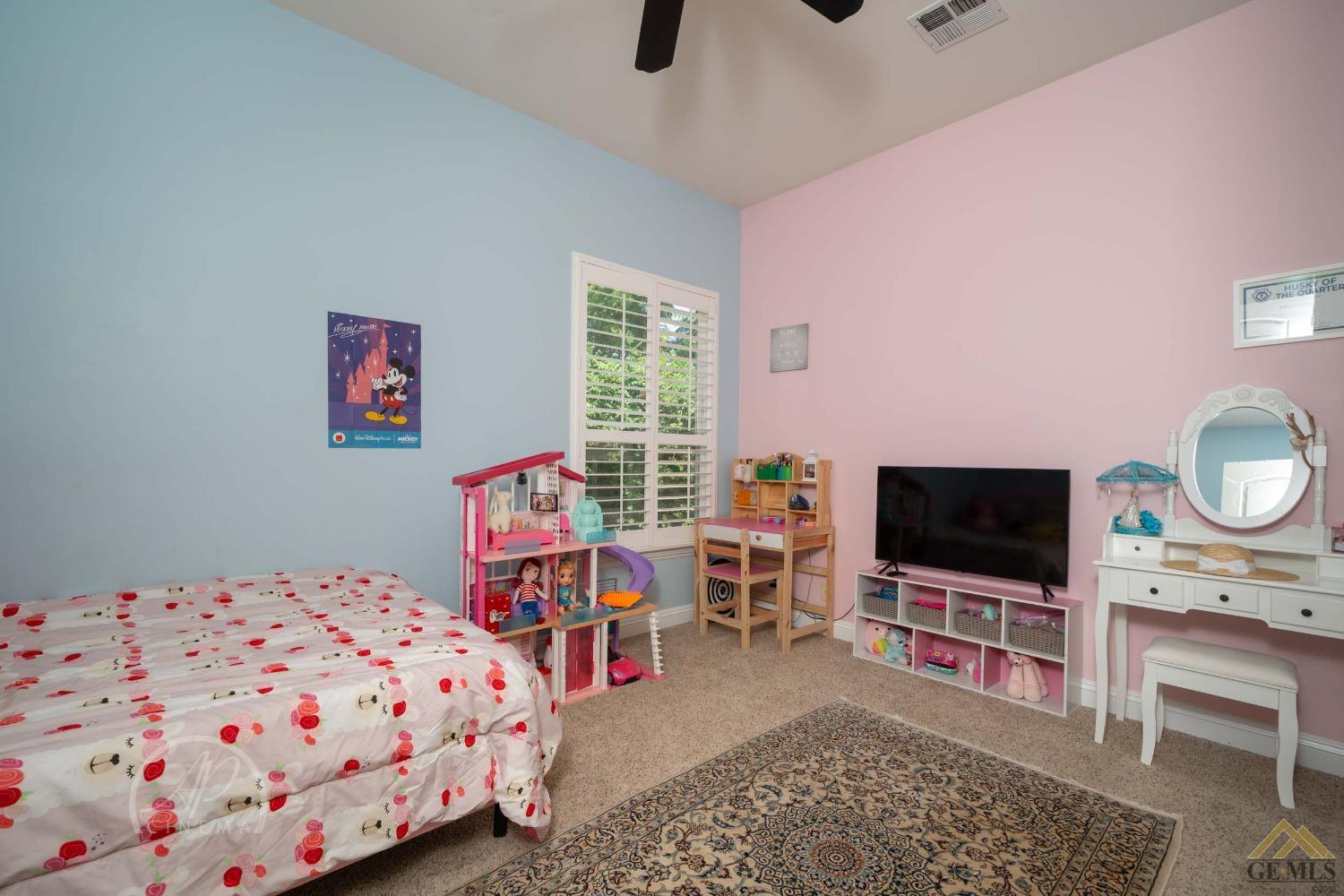 Undisclosed Address Bakersfield, CA 93311 - Photo 17 of 33 a view of a bedroom with workspace and window