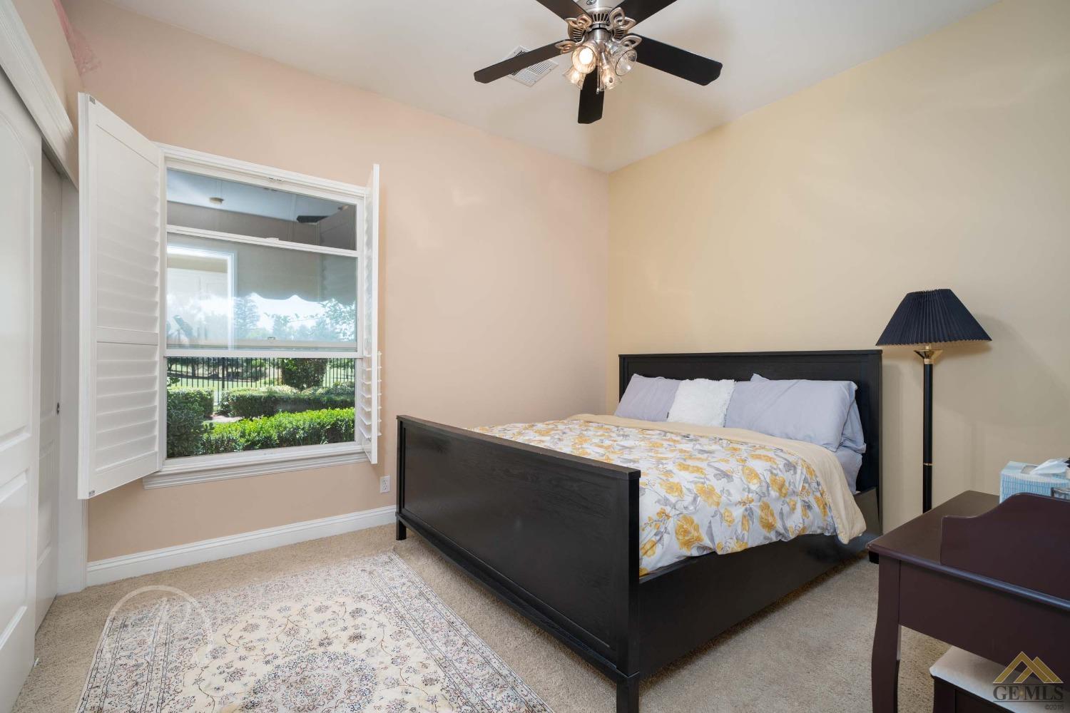 Undisclosed Address Bakersfield, CA 93311 - Photo 18 of 33 a bedroom with a bed and a window