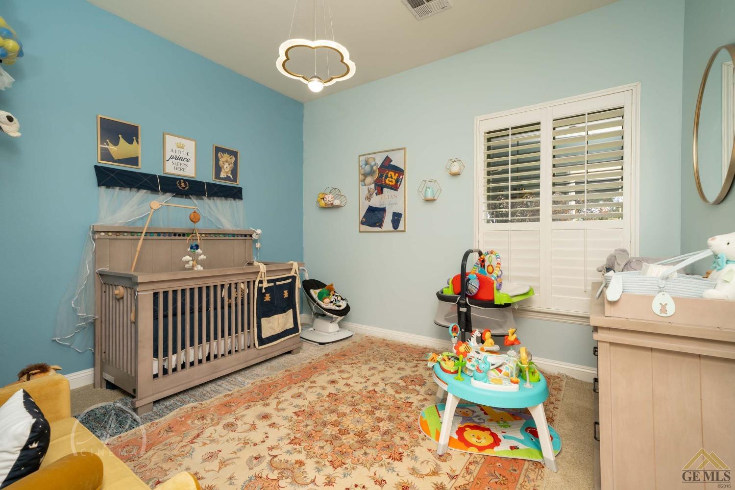 Undisclosed Address Bakersfield, CA 93311 - Photo 20 of 33 a bedroom with furniture and a window