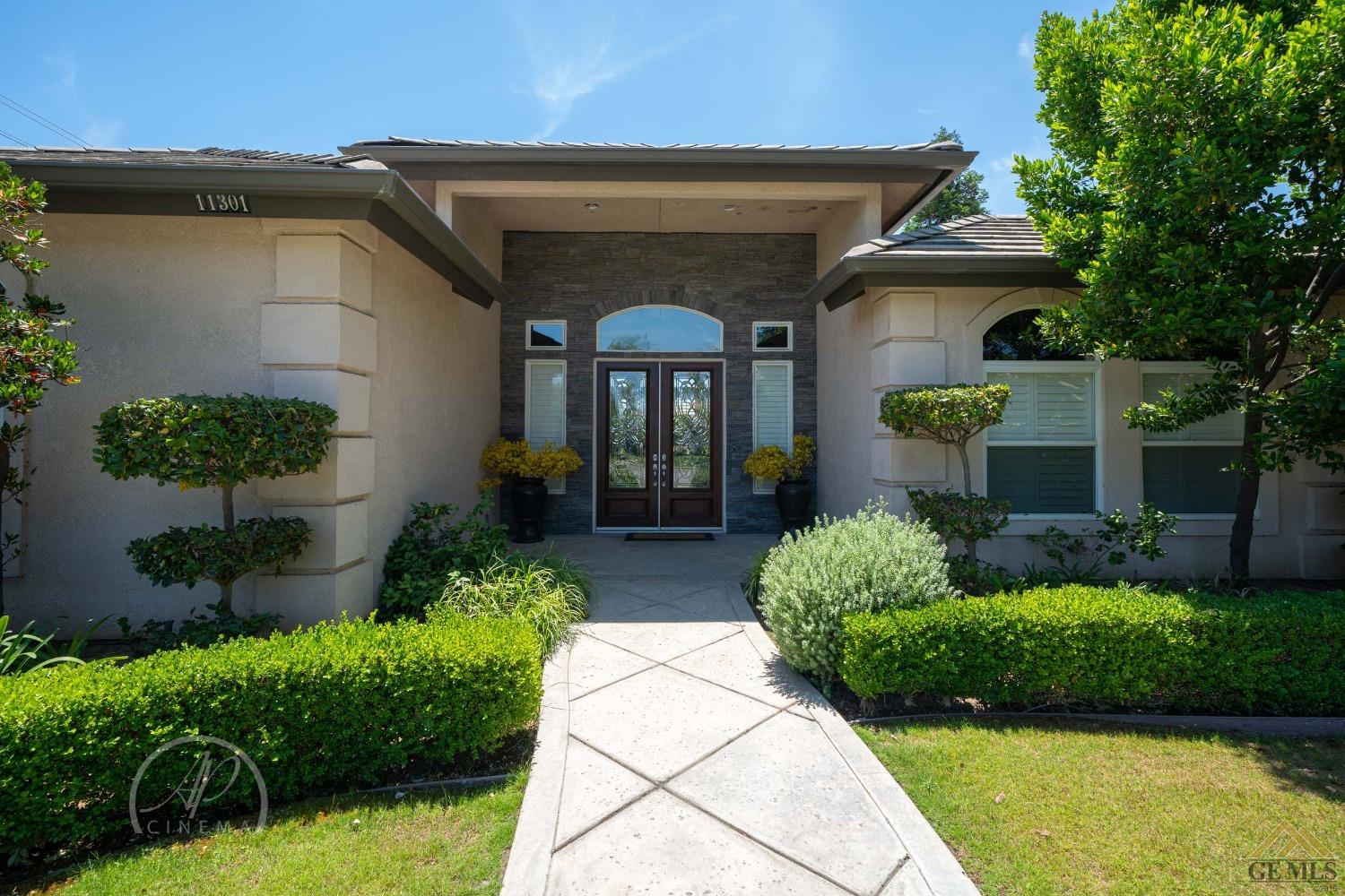 Undisclosed Address Bakersfield, CA 93311 - Photo 2 of 33 a front view of a house with garden