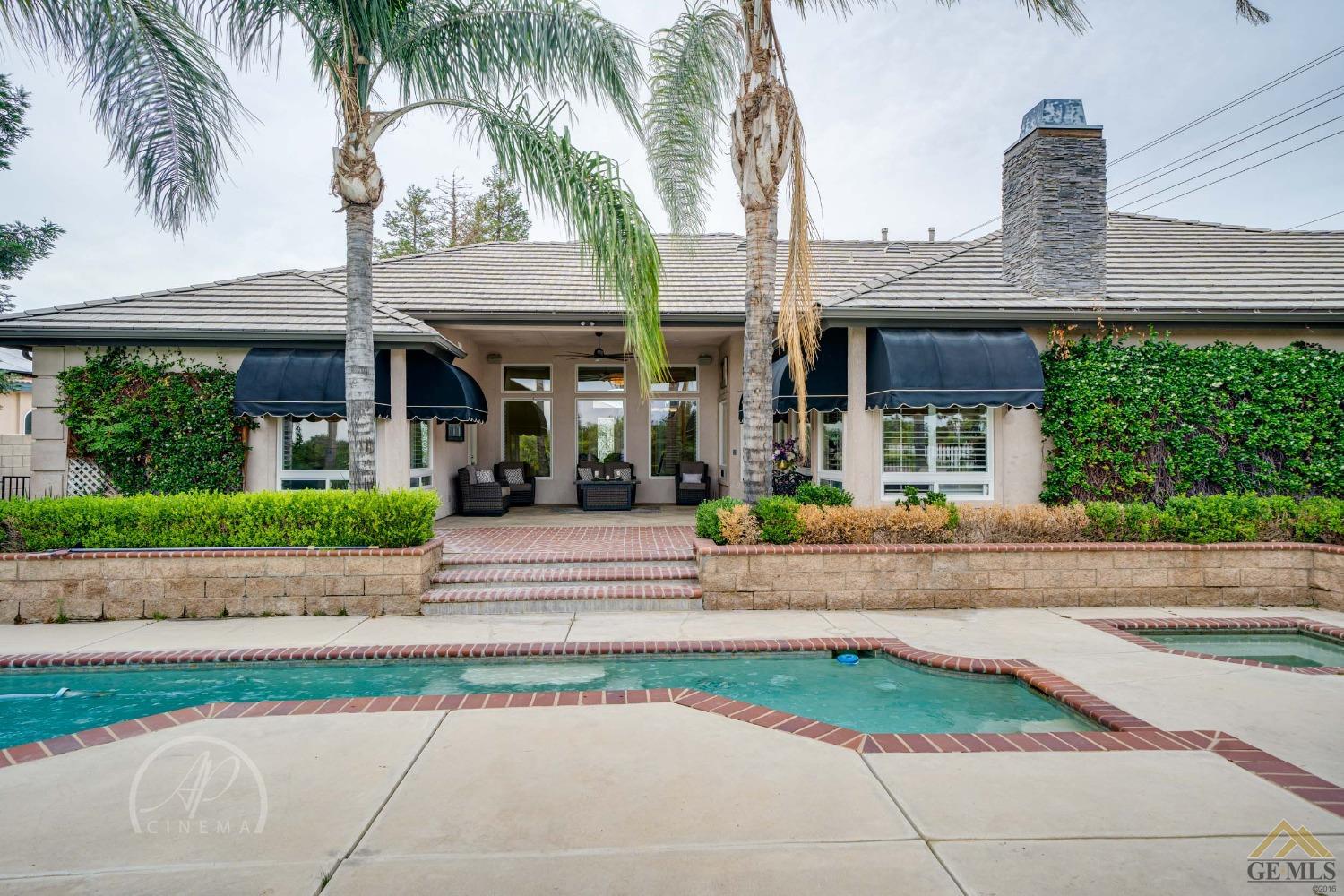 Undisclosed Address Bakersfield, CA 93311 - Photo 29 of 33 a front view of a house with a garden and plants