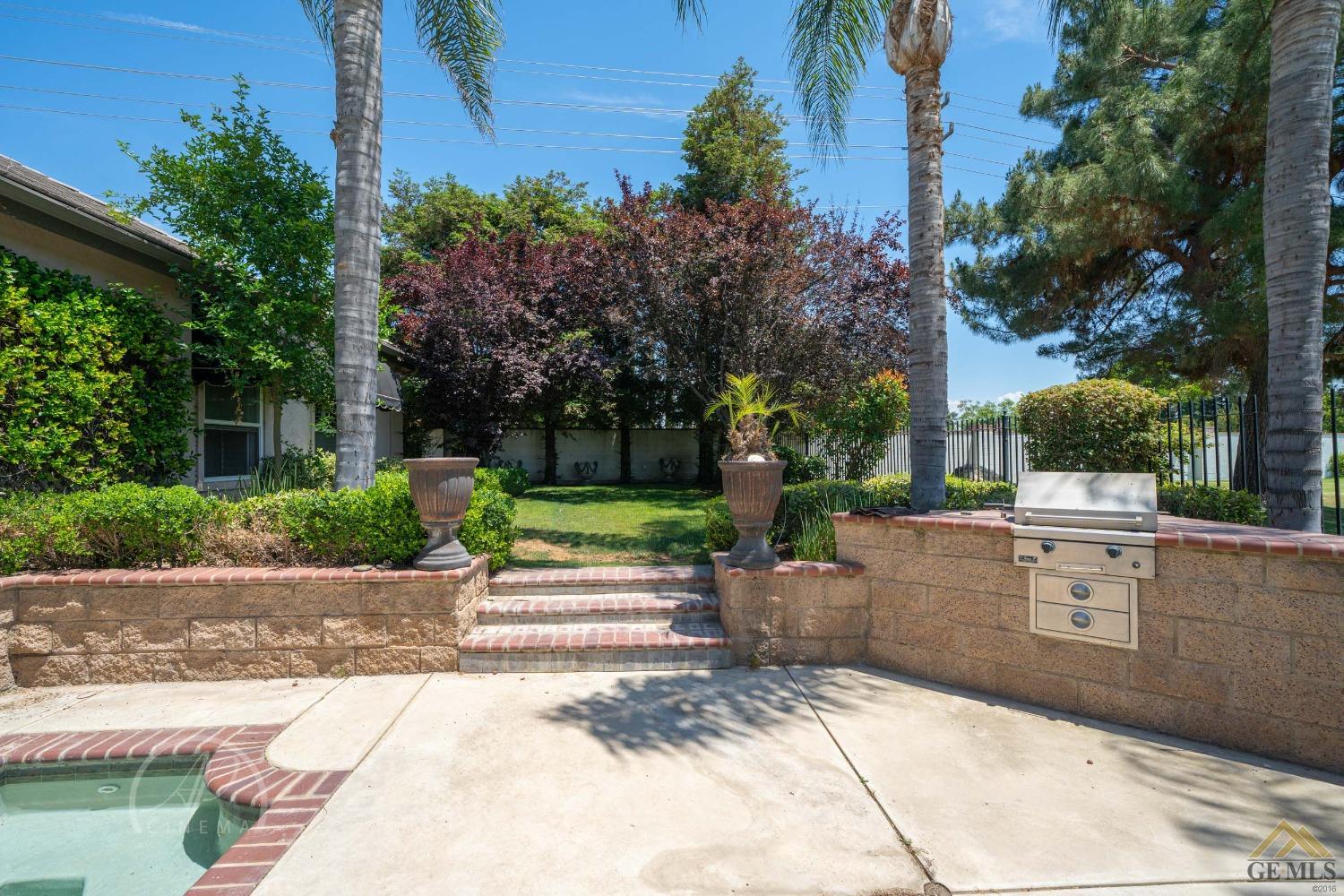 Undisclosed Address Bakersfield, CA 93311 - Photo 31 of 33 a view of backyard with swimming pool and outdoor seating