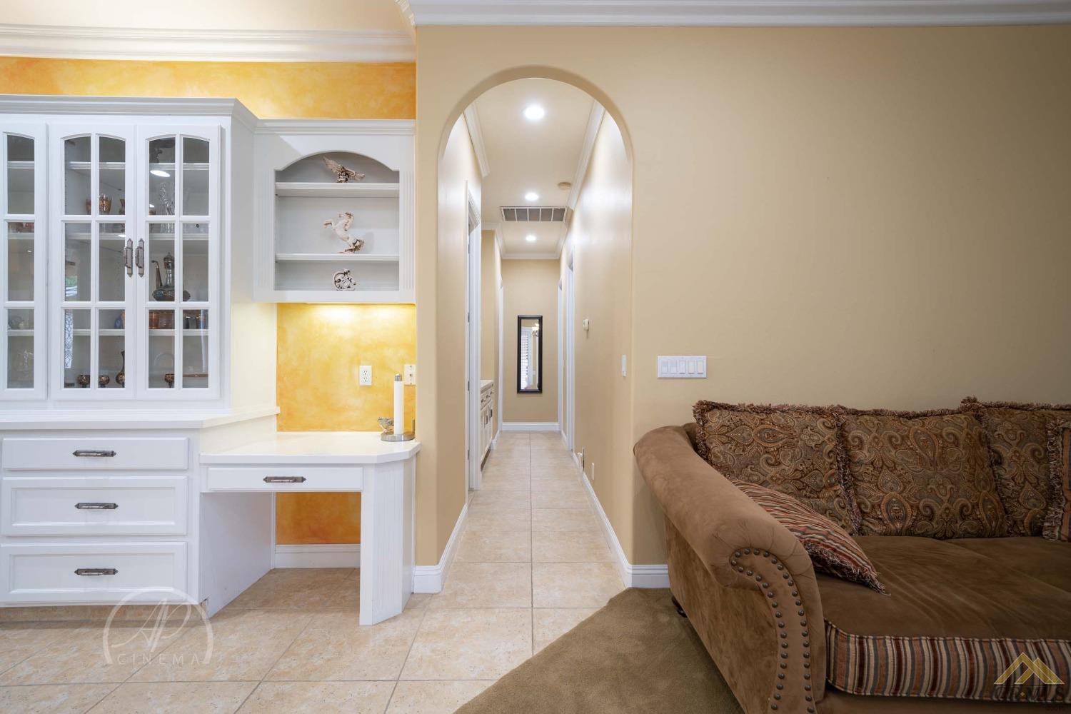 Undisclosed Address Bakersfield, CA 93311 - Photo 8 of 33 a living room with furniture and a fireplace