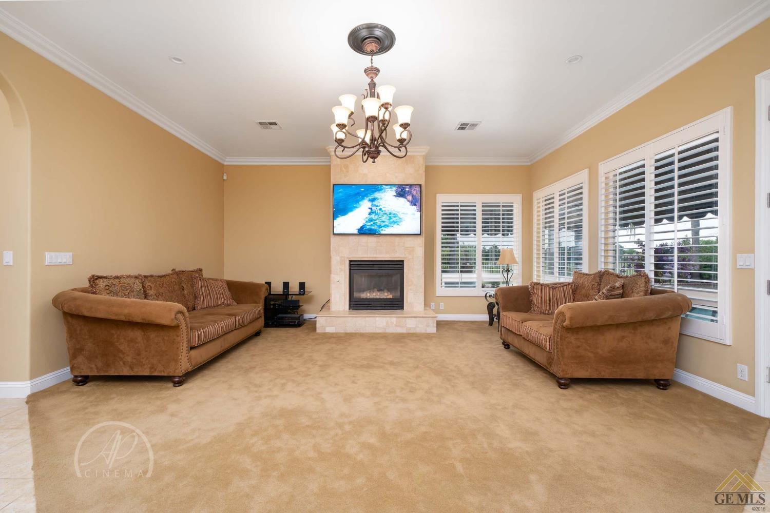 Undisclosed Address Bakersfield, CA 93311 - Photo 10 of 33 a living room with furniture and a fireplace