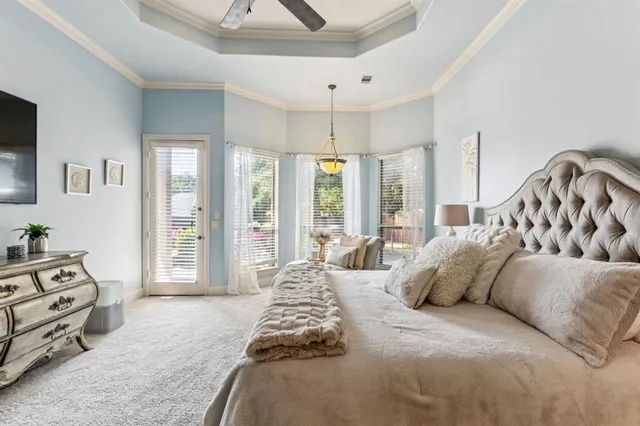 a bedroom with a bed and a couch