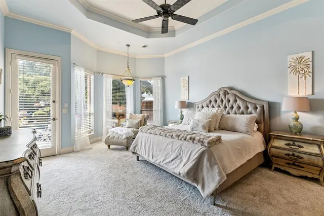 a spacious bedroom with a bed and a couch