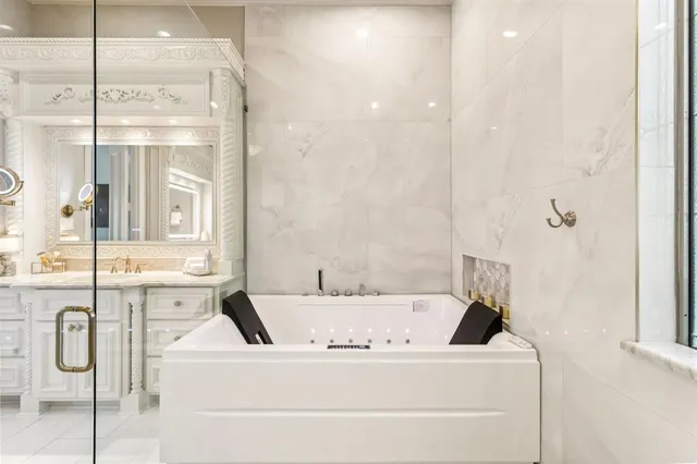 a bathroom with a bathtub and shower