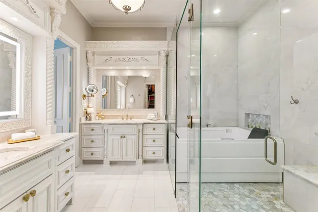 a spacious bathroom with a double vanity sink mirror and bathtub