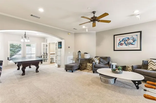 a living room with furniture a window and a table