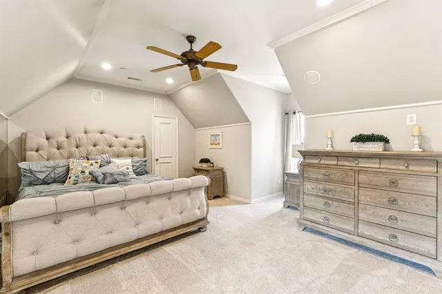 a living room with furniture and a ceiling fan