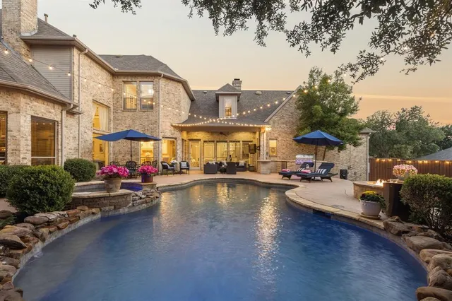 a view of a swimming pool with a lounge chairs