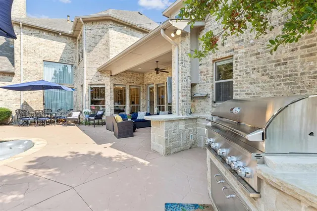 a view of a patio with couches and potted plants