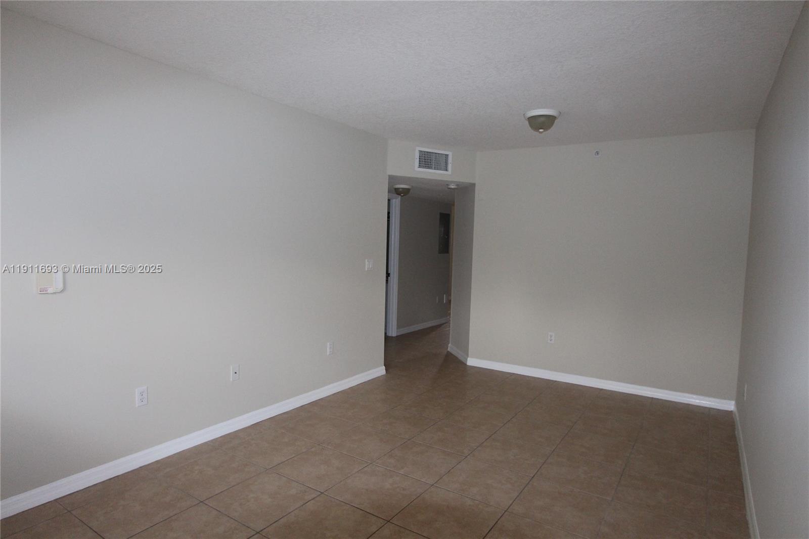 22801 Southwest 88th Place, Unit 205 Cutler Bay, FL 33190 - Photo 12 of 36 a view of an empty room