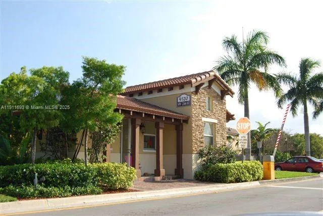 a view of a yard and palm trees