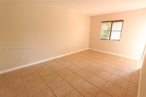 an empty room with a bathroom
