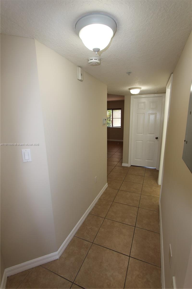 22801 Southwest 88th Place, Unit 205 Cutler Bay, FL 33190 - Photo 4 of 36 an empty room with a bathroom