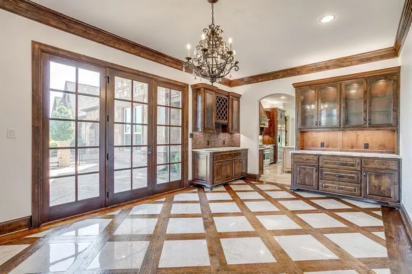 a very nice looking room with a large window and chandelier