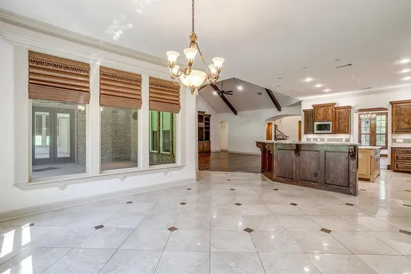 a view of a kitchen with furniture and a window