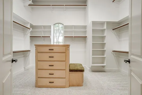 a view of an empty walk in closet