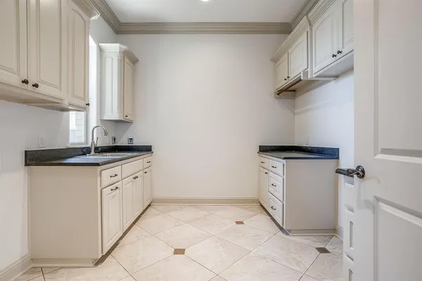 a view of an empty room and a ceiling fan