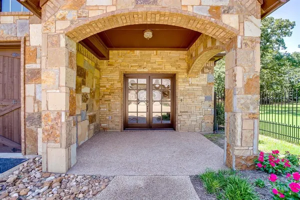 a kitchen with stainless steel appliances granite countertop a refrigerator stove top oven and sink