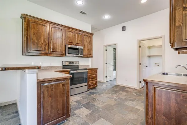 an empty room with a empty space and a ceiling fan