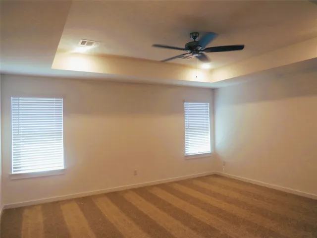 a bathroom with a tub sink and shower