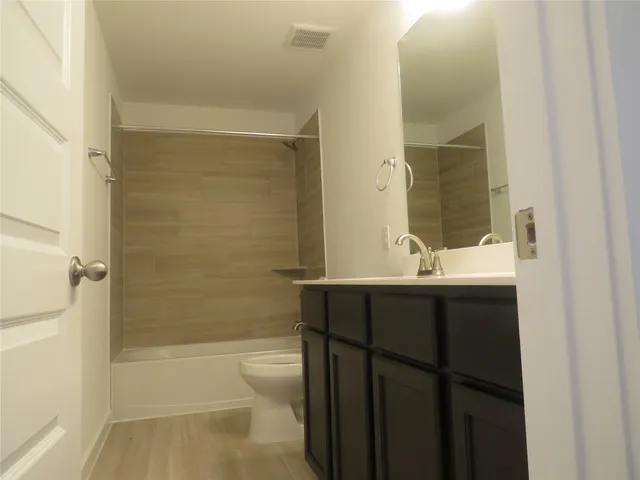 a view of a room and racks on the wall