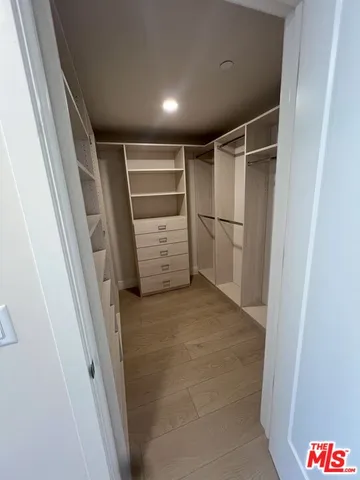 a bathroom with a granite countertop sink a toilet and a mirror