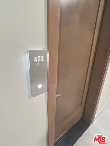 a large kitchen with stainless steel appliances granite countertop a stove a sink and a refrigerator