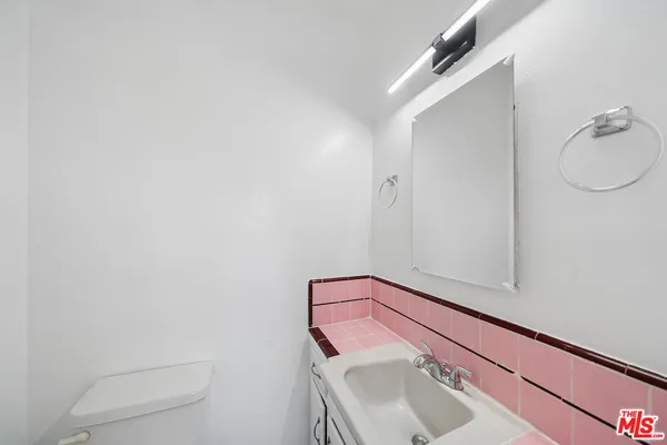 a bathroom with a sink and vanity