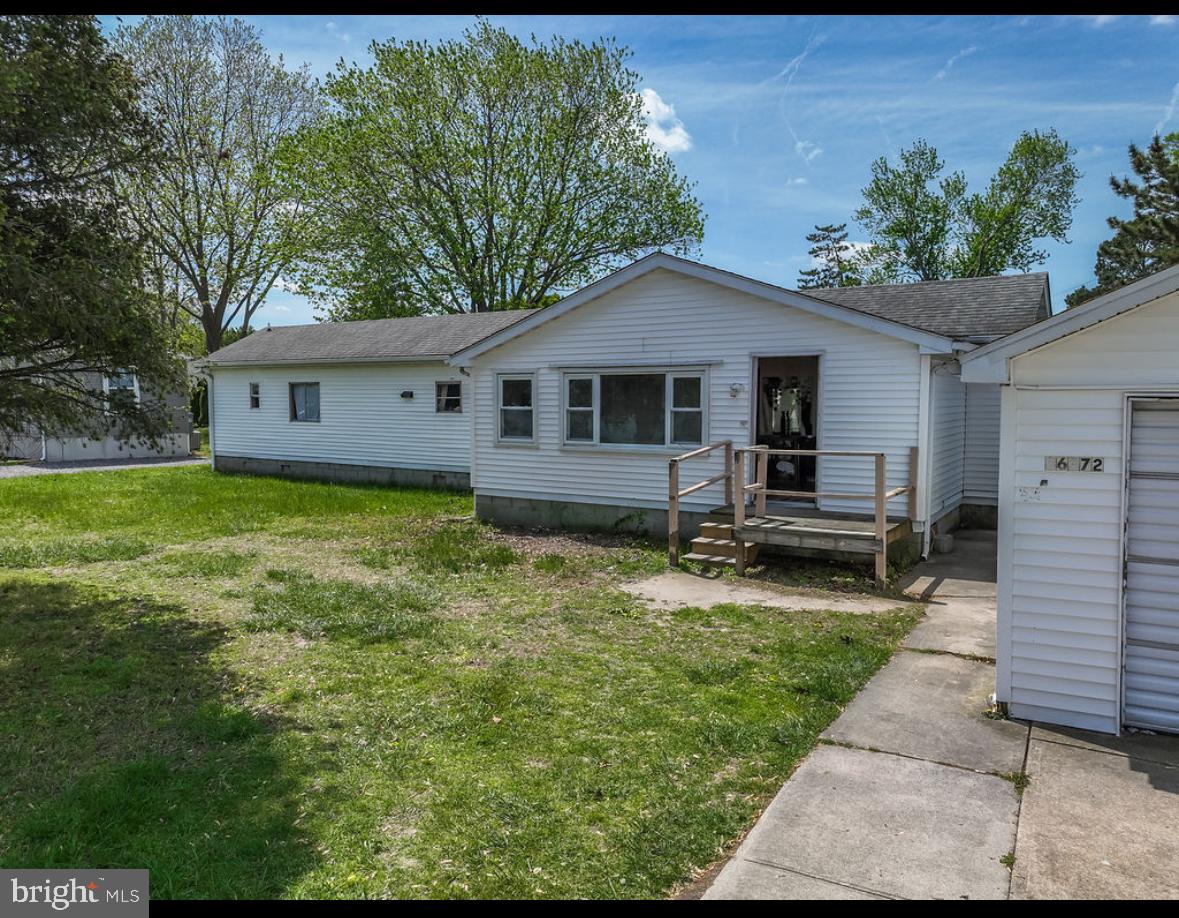 36372 Old Mill Road Ocean View, DE 19970 - Photo 3 of 14 a front view of house with yard and green space