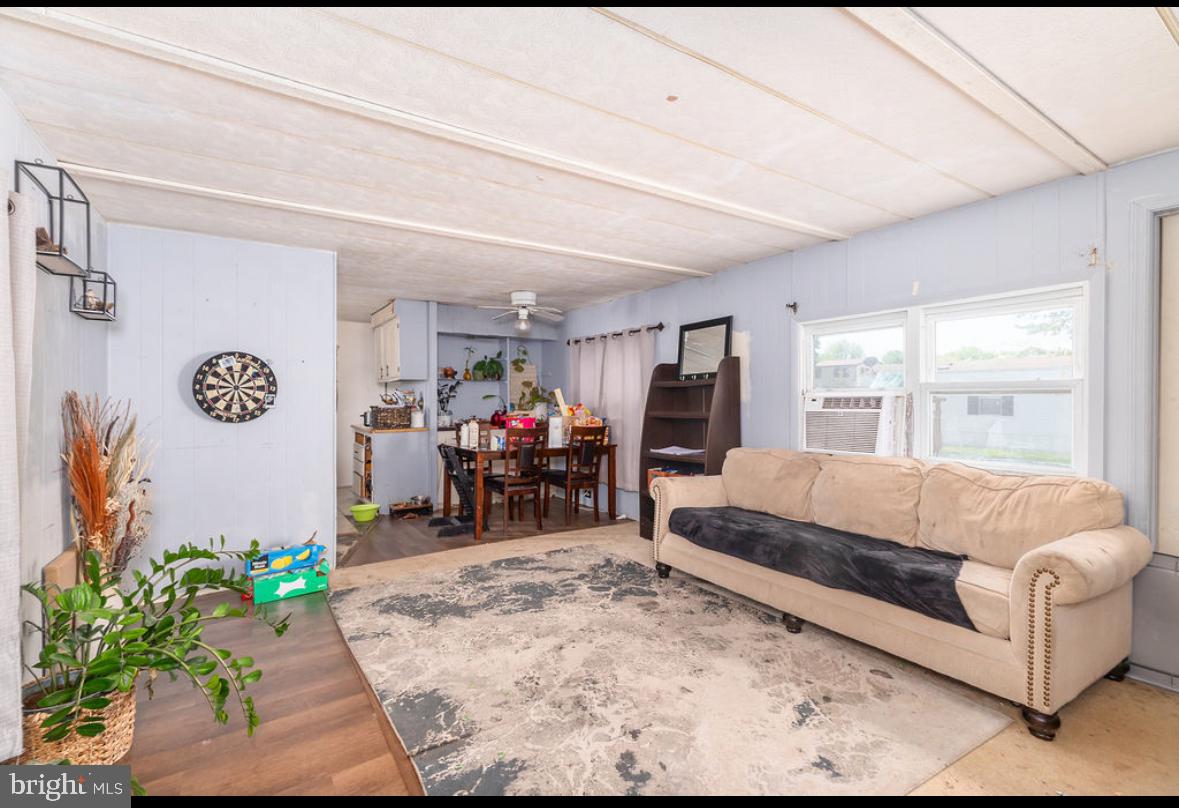 36372 Old Mill Road Ocean View, DE 19970 - Photo 7 of 14 a living room with furniture and a large window