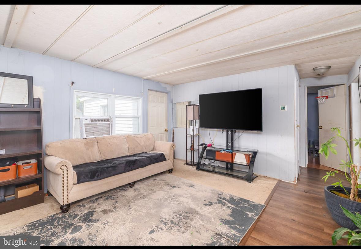 36372 Old Mill Road Ocean View, DE 19970 - Photo 8 of 14 a living room with furniture and a flat screen tv