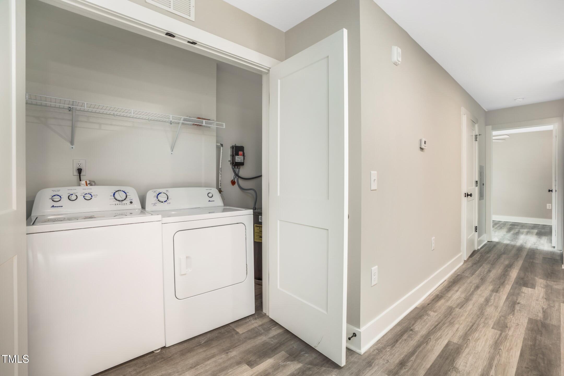 303 Linwood Street, Unit 306 Apex, NC 27502 - Photo 12 of 19 a view of utility room with washer and dryer