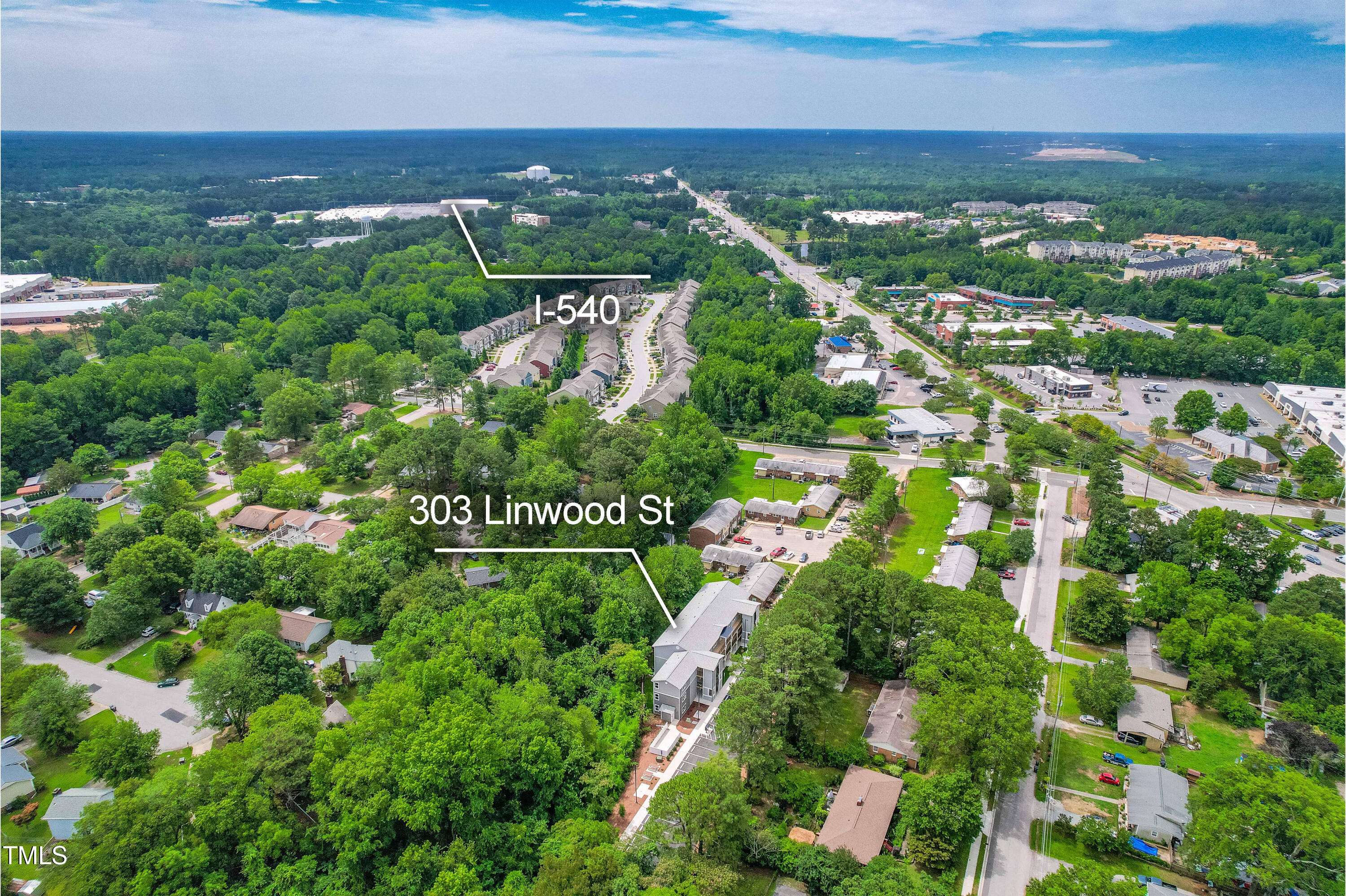 303 Linwood Street, Unit 306 Apex, NC 27502 - Photo 14 of 19 an aerial view of residential houses with outdoor space and street view