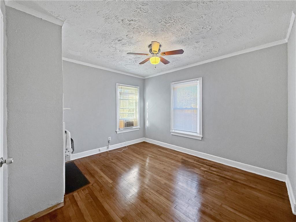 109 Vine Street Southwest, Unit A Atlanta, GA 30314 - Photo 6 of 14 a view of an empty room with window and wooden floor