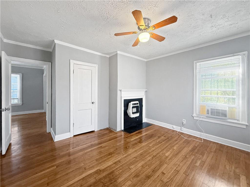 109 Vine Street Southwest, Unit A Atlanta, GA 30314 - Photo 7 of 14 a view of an empty room with wooden floor and a window