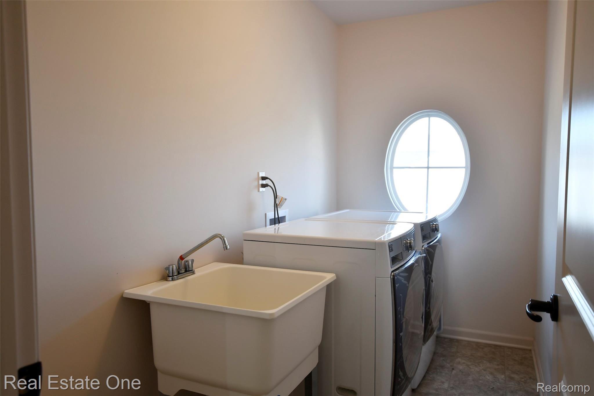 3087 Curtis Road Wixom, MI 48393 - Photo 27 of 36 2nd floor laundry.jpg