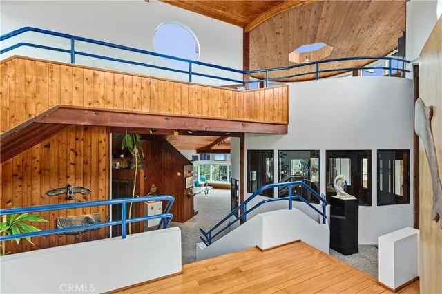 a house with a yard and wooden fence