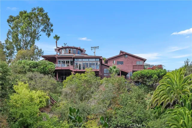 a spacious bedroom with two beds and a fireplace