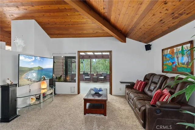 a view of a room with wooden floor and windows