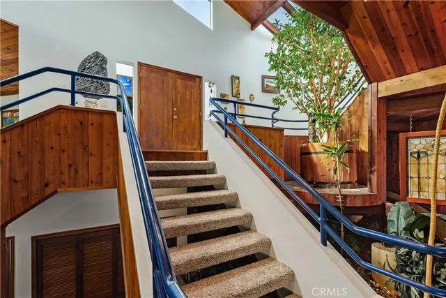 a view of a house with a yard and garden