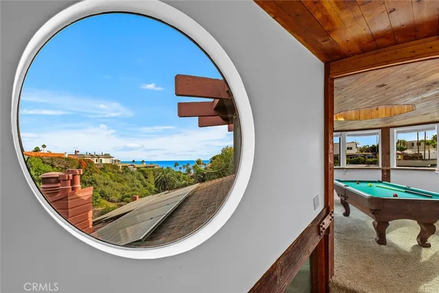 a view of play room with furniture and a window
